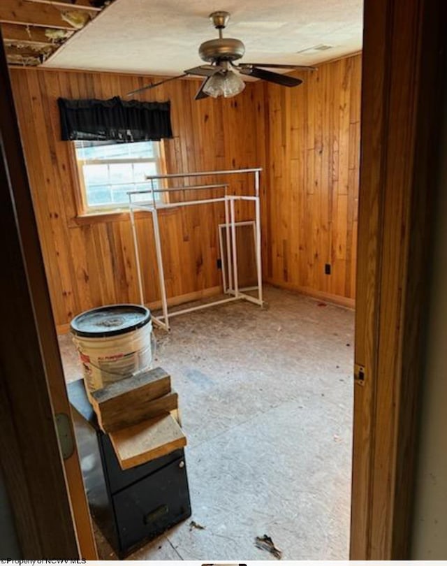 interior space featuring ceiling fan