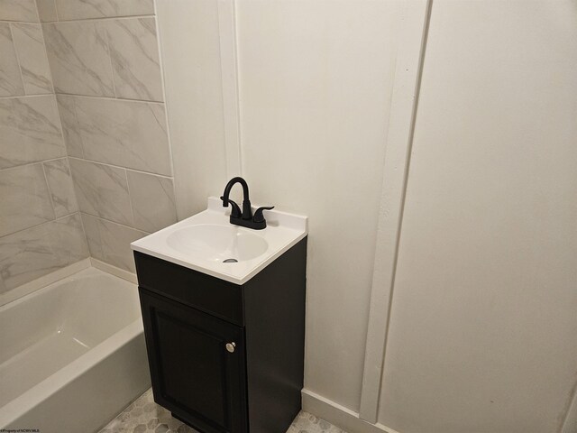 bathroom featuring vanity, shower / bathing tub combination, and tile patterned floors