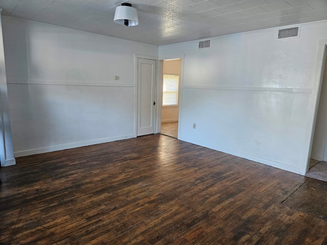 spare room featuring hardwood / wood-style floors