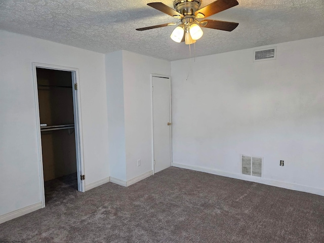 unfurnished bedroom with carpet floors, a textured ceiling, ceiling fan, and a closet