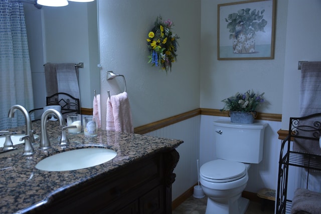 bathroom with vanity and toilet