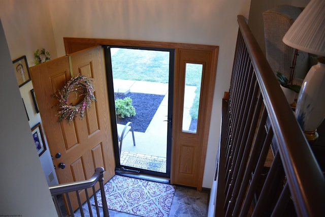 foyer entrance featuring light tile patterned flooring