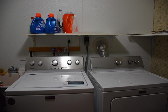 clothes washing area with washer and dryer