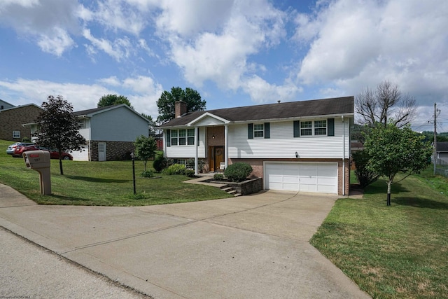 bi-level home featuring a garage and a front yard