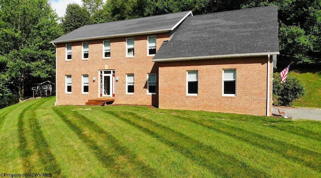 colonial home with a front yard