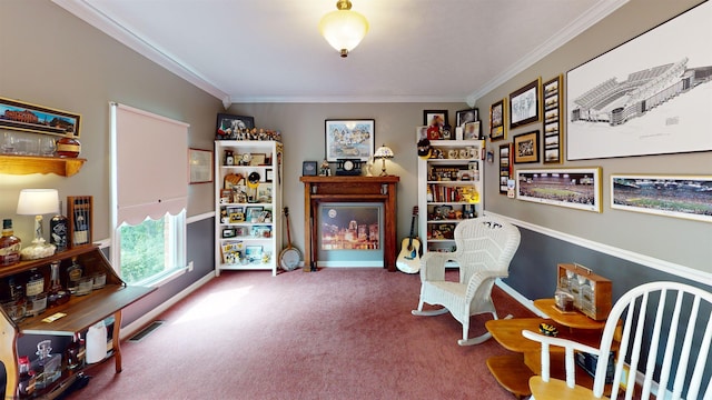 sitting room with carpet and ornamental molding