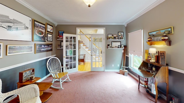 living area featuring carpet flooring, french doors, and ornamental molding