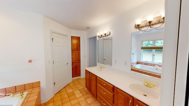 bathroom featuring vanity, tiled bath, and tile patterned floors