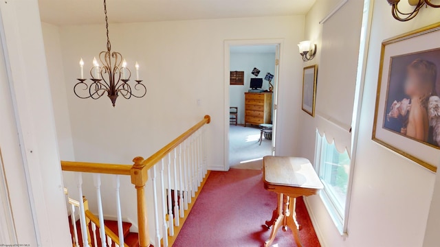 corridor featuring carpet and an inviting chandelier