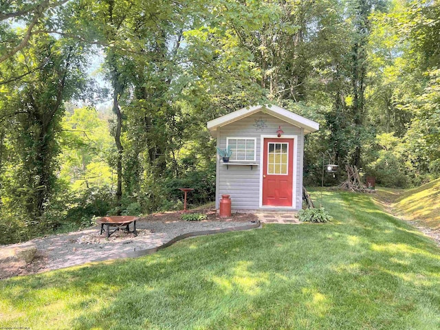 view of outbuilding featuring a lawn