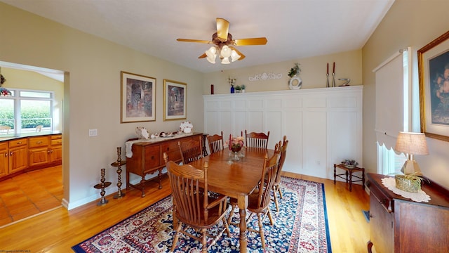 dining area with ceiling fan and light wood-type flooring