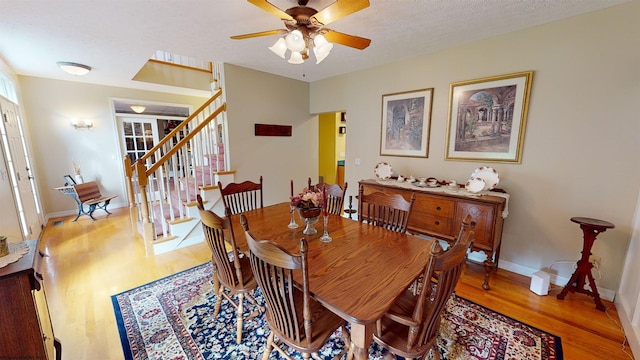 dining room featuring light hardwood / wood-style floors and ceiling fan