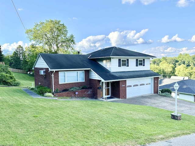 view of front of property with a front yard, a garage, and a wall unit AC