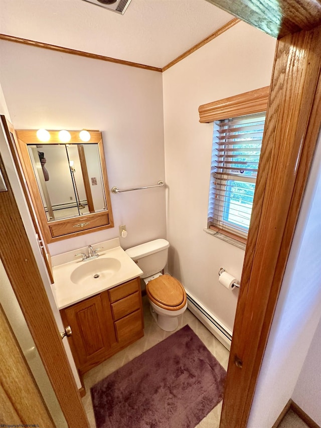 bathroom with vanity, a baseboard radiator, toilet, and crown molding