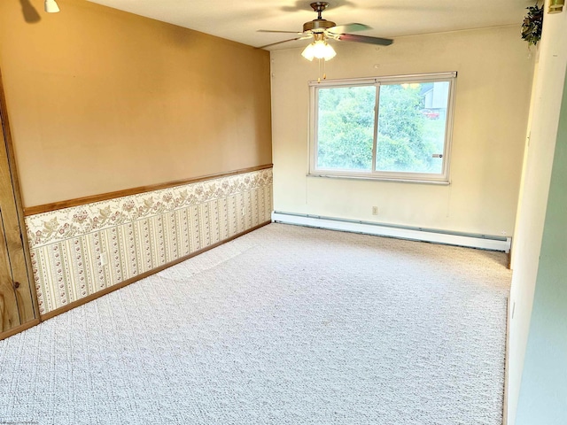 spare room featuring ceiling fan and a baseboard radiator