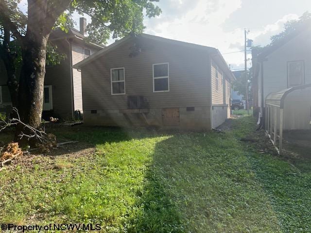 view of home's exterior with a yard