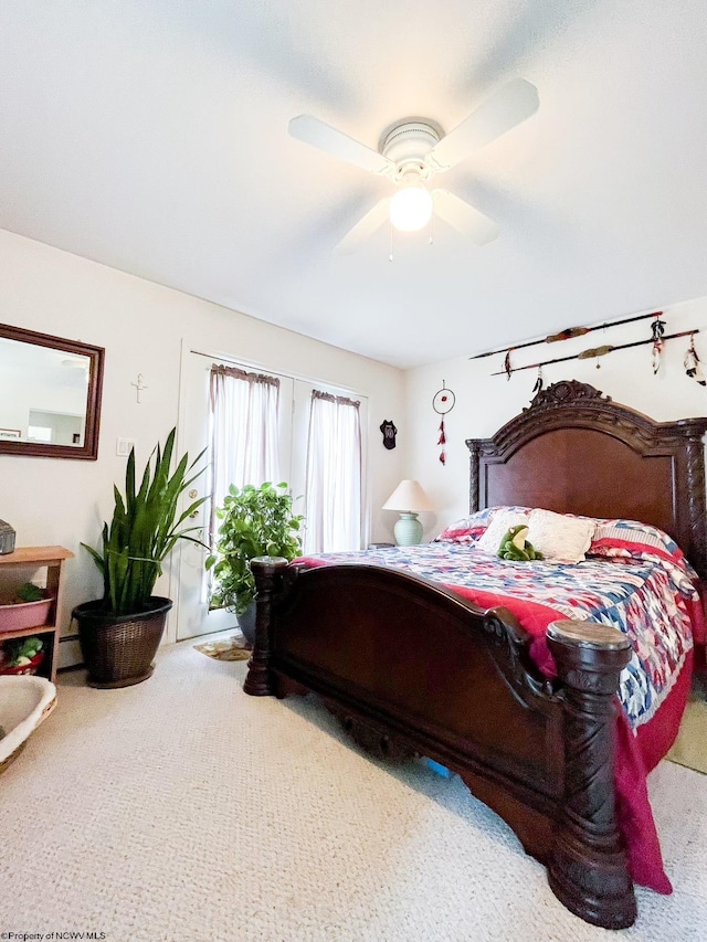 bedroom featuring ceiling fan, carpet, and a baseboard radiator