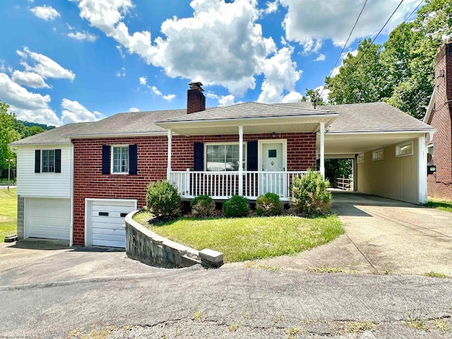 view of front facade with a porch, a garage, a carport, and a front yard