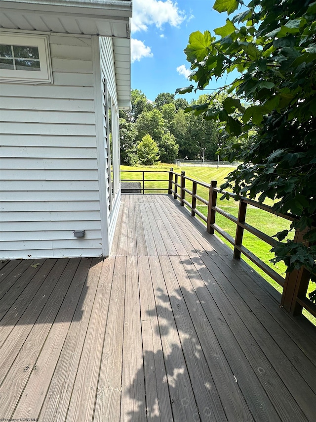 wooden deck with a yard