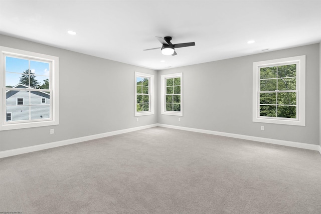 spare room with carpet and ceiling fan