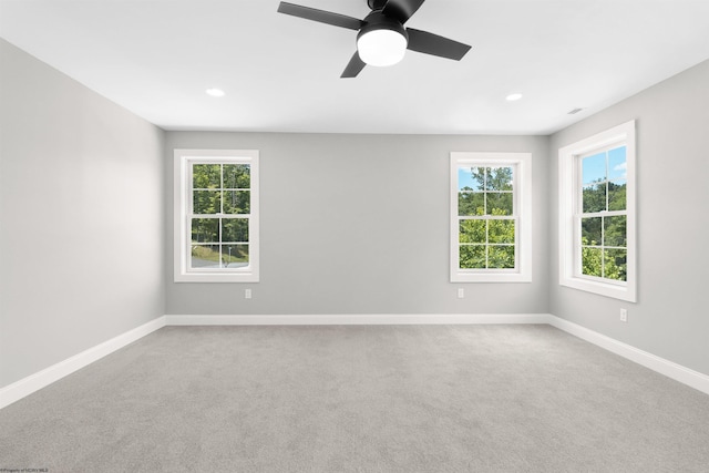 carpeted empty room with ceiling fan