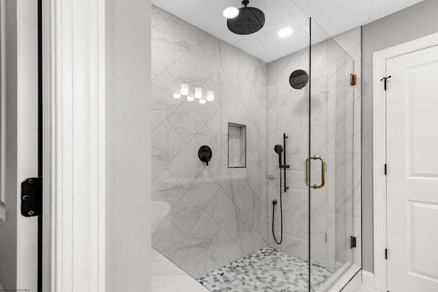 bathroom with a shower with shower door