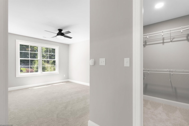 interior space featuring ceiling fan