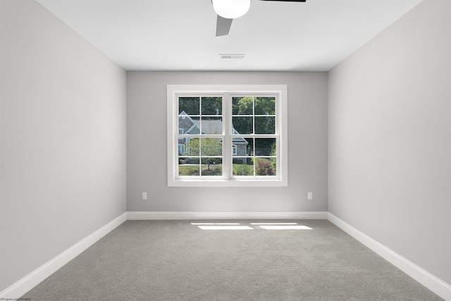 carpeted empty room with ceiling fan