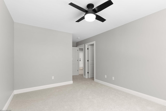 unfurnished bedroom featuring light carpet and ceiling fan