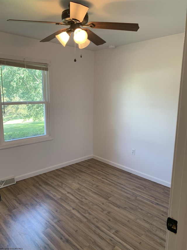 spare room featuring dark hardwood / wood-style flooring