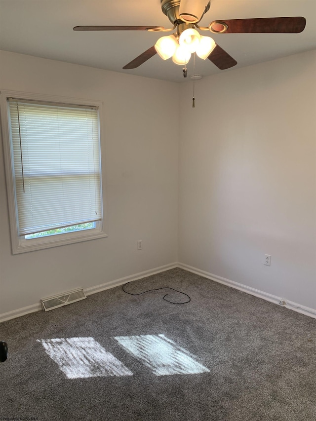 unfurnished room featuring a healthy amount of sunlight, carpet floors, and ceiling fan