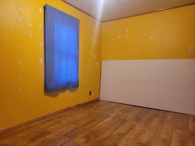 empty room featuring hardwood / wood-style flooring