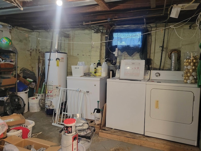 washroom with separate washer and dryer and water heater