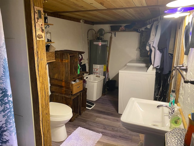 bathroom with gas water heater, hardwood / wood-style floors, washer / dryer, toilet, and wood ceiling