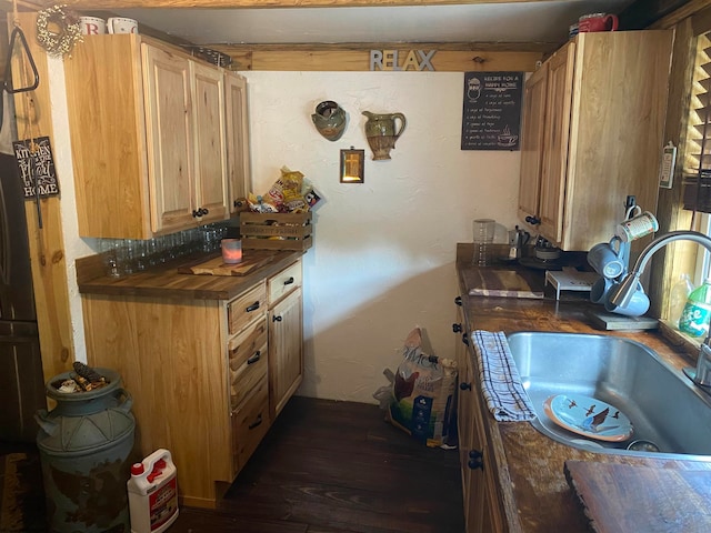 kitchen with sink and wood-type flooring