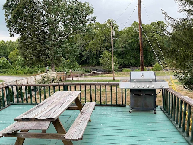 wooden terrace featuring area for grilling