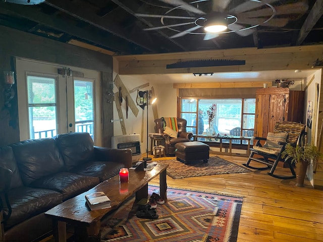 living room featuring french doors and hardwood / wood-style floors