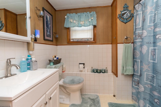 bathroom featuring vanity, tile walls, curtained shower, and toilet