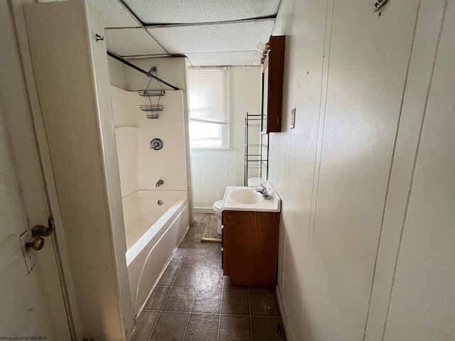 full bathroom featuring vanity, tub / shower combination, toilet, and tile patterned floors