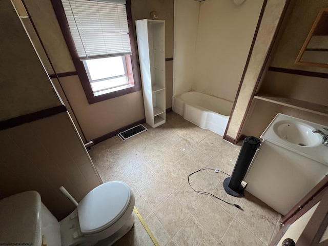 bathroom featuring vanity, toilet, and tile patterned flooring