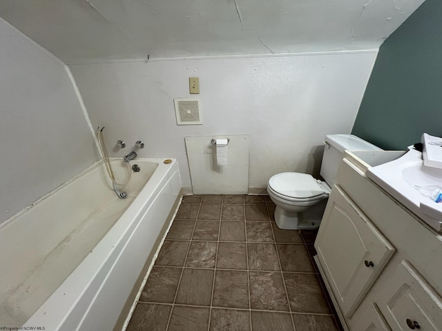 bathroom with vanity, tile patterned flooring, and toilet