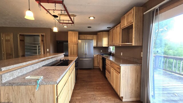 kitchen with dark wood-type flooring, black appliances, light brown cabinets, and sink