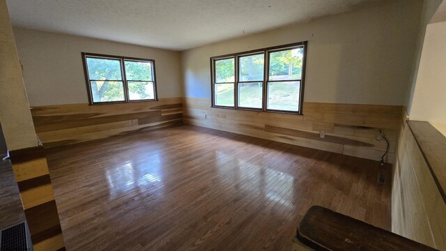 unfurnished room featuring dark hardwood / wood-style flooring