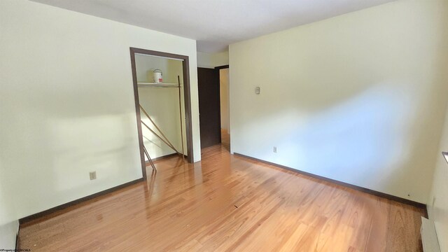 spare room with light hardwood / wood-style flooring