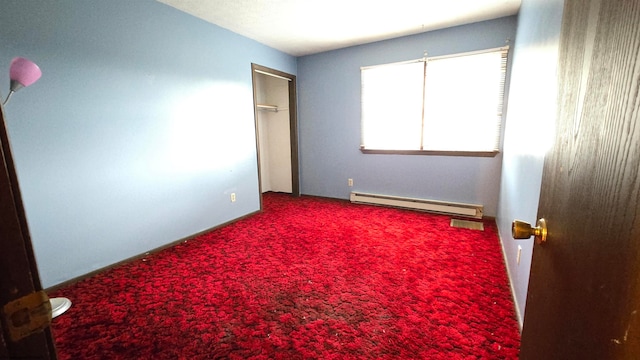 unfurnished bedroom featuring a baseboard heating unit and carpet