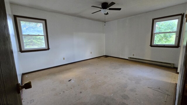 spare room featuring a baseboard radiator and ceiling fan