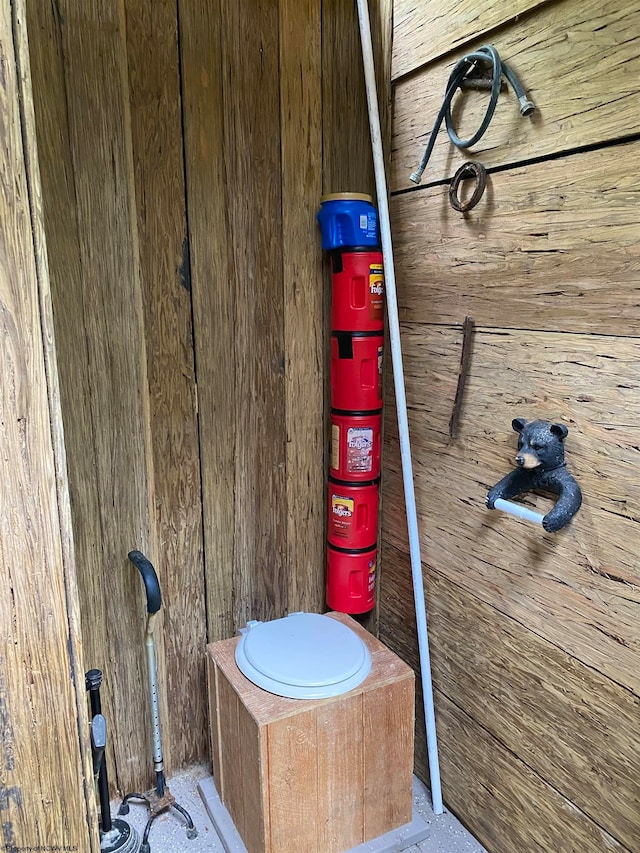 bathroom with wooden walls