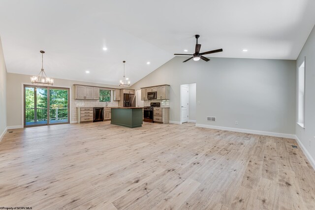 unfurnished living room featuring high vaulted ceiling, ceiling fan with notable chandelier, and light hardwood / wood-style flooring