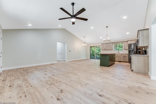 kitchen featuring tasteful backsplash, hanging light fixtures, a center island, and light wood-type flooring