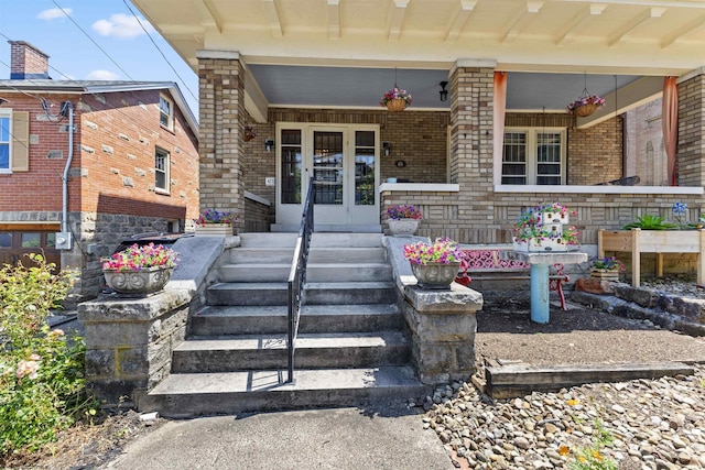 view of exterior entry featuring french doors